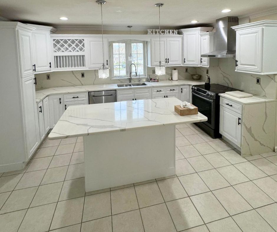 White kitchen with marble island